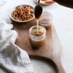 Dairy free caramel sauce dripping off a spoon in