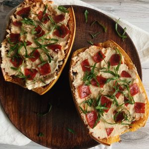 Spaghetti squash boats filled with pizza toppings