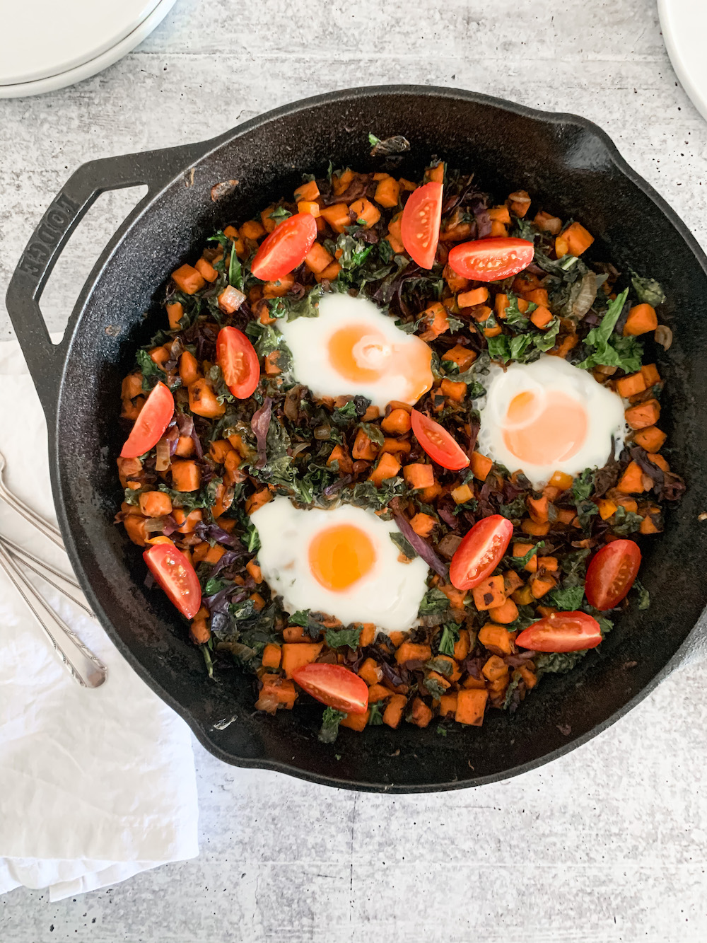 pan of healthy breakfast hash with eggs