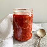 A jar of strawberry compote.