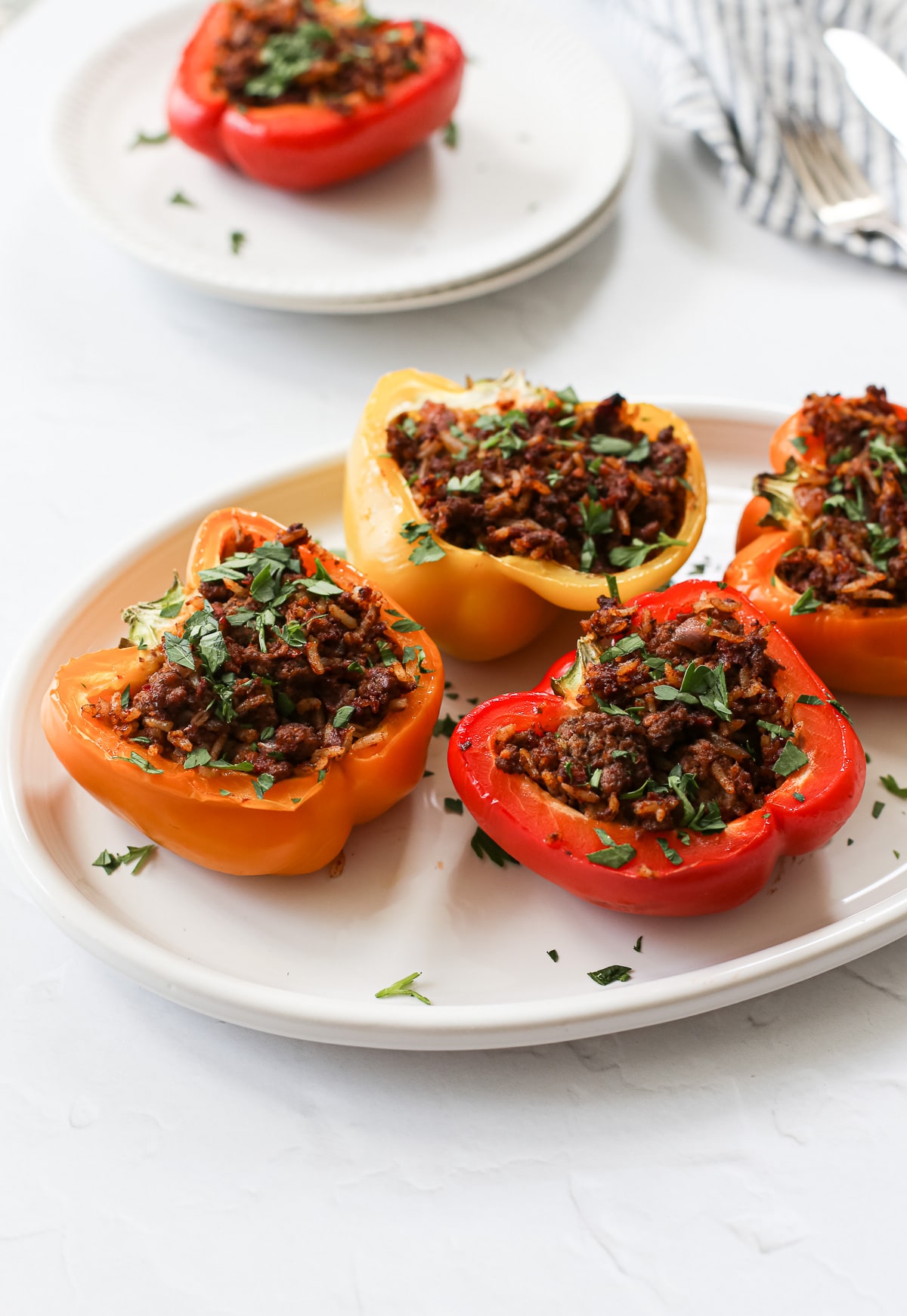 Easy dairy-free stuffed peppers with fresh parsley.