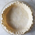 Dairy-free pie dough pressed into a pie pan.