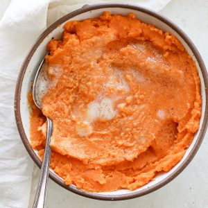 A bowl of orange vegan sweet potato puree.